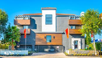 A house with two orange flags in front of it